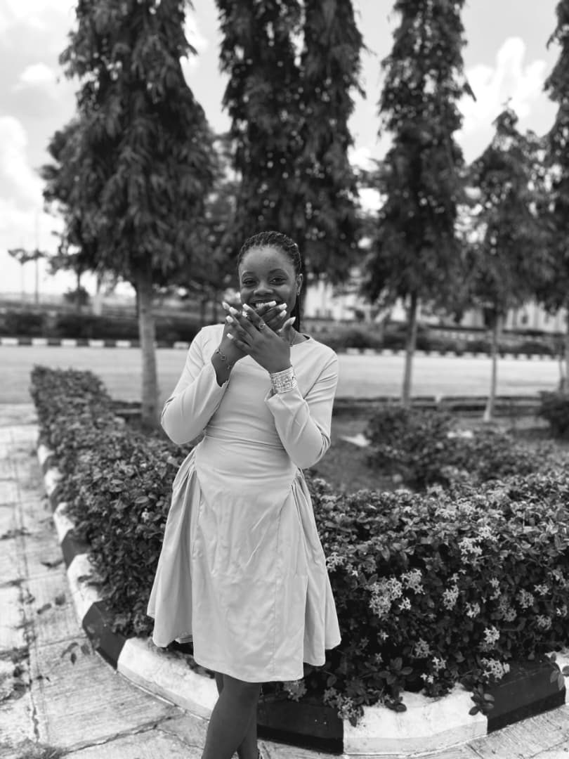 Neriah laughing with her hands over her mouth